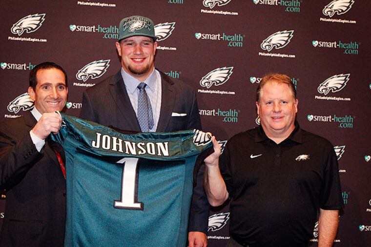 Eagles general manager Howie Roseman (left) and coach Chip Kelly (right) introduce number one draft pick Lane Johnson at a press conference. ( MICHAEL S. WIRTZ / STAFF PHOTOGRAPHER ). April 26, 2013.