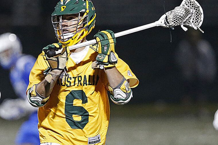 Australia's Thomas Graham (6) advances downfield with the ball guarded
by Israel's Matthew Cherry in a semi-final game of the Lacrosse World
Championships, in Commerce City, Colo., Wednesday, July 16, 2014. Australia won 9-8. (AP Photo/Brennan Linsley)