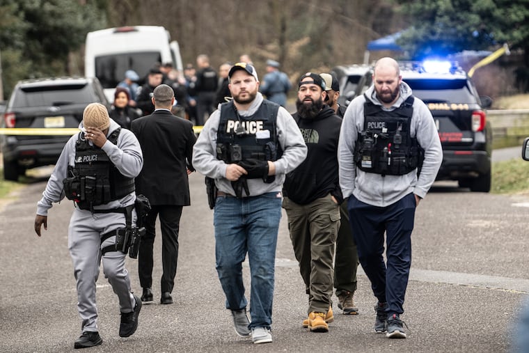 Police investigate the scene of a fatal police-involved shooting in Westville, Gloucester County, on Friday.