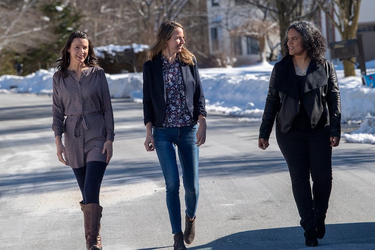 Melinda McCann, center, pose for a photo with her sister, Mary Brady, left, and her cousin, Alicia Karr near her home in Exton, Pa. Thursday, February 4, 2021. Melinda, her sister, and her cousin have formed a group that is helping people find appointments for covid-19 vaccination. What started as a project to help their family has turned into a service for strangers who are challenged by the state's complicated navigation system.