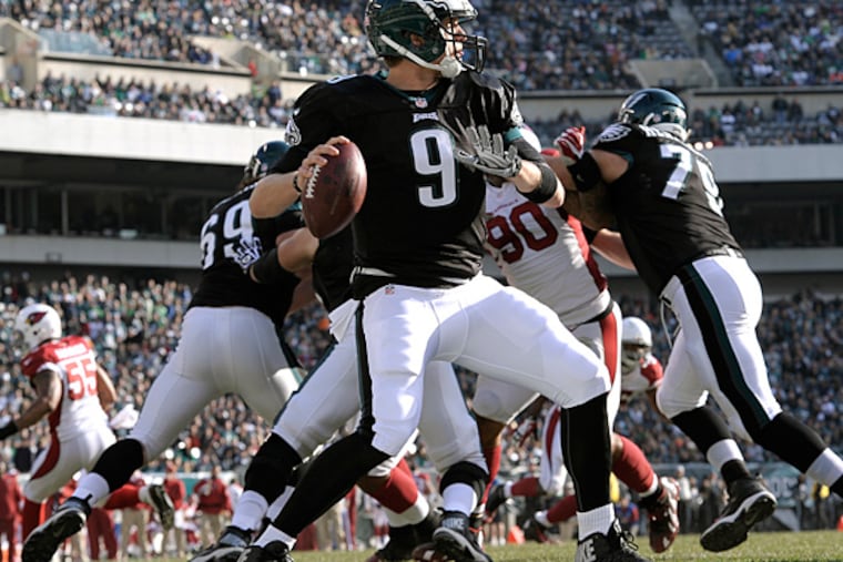 Eagles quarterback Nick Foles looks to pass during the first half against the Arizona Cardinals. (Michael Perez/AP)
