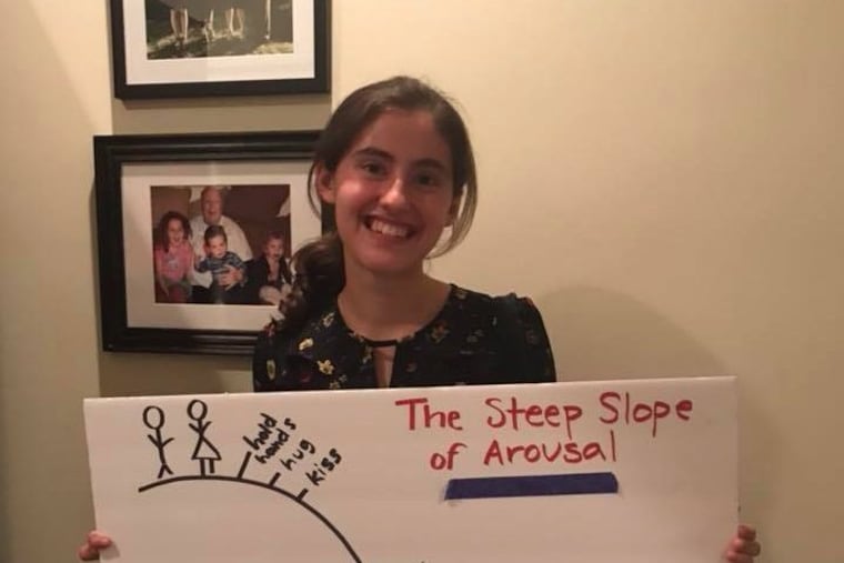 Abby McElroy, 17, holds a poster from the sex ed class presented by Amnion Crisis Pregnancy Center at Strath Haven High School for the past three years.