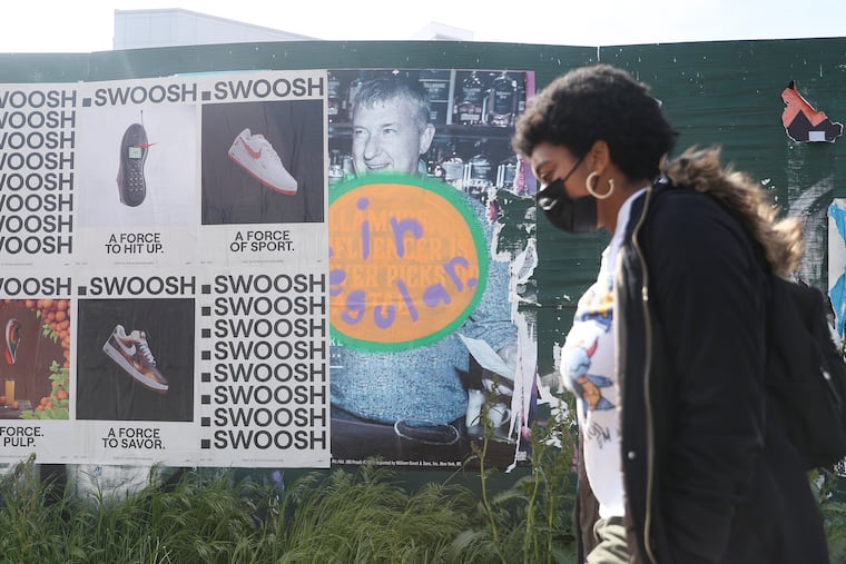 An “irregular” tag by Sean Hassett, who goes by artist name Irregular, is seen along 11th St. by Spring Garden in Philadelphia on Wednesday, April 19, 2023. The Darby native started placing these tags on eroded barricades, train cars, wooden panels and the corners of abandoned buildings in 2020 and has slowly built up his artistic presence and social media following.