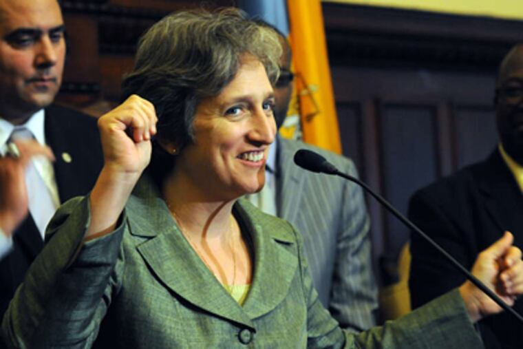 Philadelphia City Commissioner Stephanie Singer celebrates the court ruling on the state voter-ID law. Critics of the law argued that it could suppress turnout in heavily Democratic areas such as Philadelphia and that its implementation was rushed to affect the outcome of the presidential election. APRIL SAUL / Staff