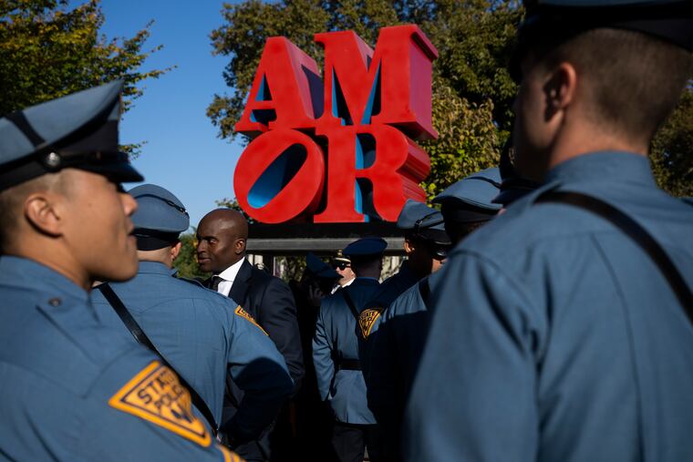 Law enforcement officers gather for a viewing for officer Richard Mendez at the Cathedral Basilica of Saints Peter and Paul in Philadelphia, Tuesday. Mendez was shot and killed, and a second officer was wounded, when they confronted people breaking into a car at Philadelphia International Airport.