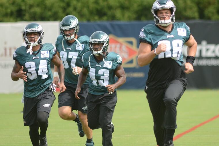 From left, Donnel Pumphrey (34) Brent Celek (87), Darren Sproles (43) and Zach Ertz (86) runs sprints during training camp.