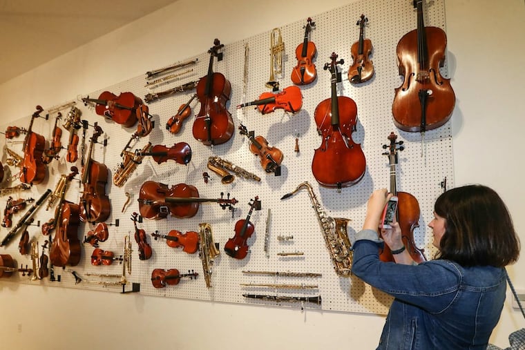 Art teacher Sunny Lee Mowery photographs broken instruments from Philadelphia public schools.