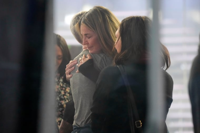 Savannah Guthrie hugs a staff member during a visit to the Today show at Rockefeller Plaza in New York on Thursday, March 5, 2026.