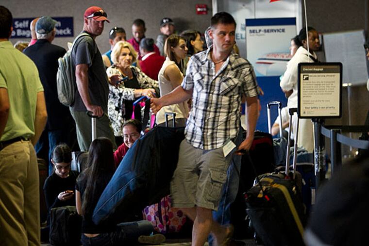 Activity around Terminal A-East Arrivals at the Philadelphia International Airport on Monday, July 29, 2013. Passengers on American airlines and other carriers in this terminal are dealing with problems to computer and power issues. ( ALEJANDRO A. ALVAREZ / STAFF PHOTOGRAPHER )