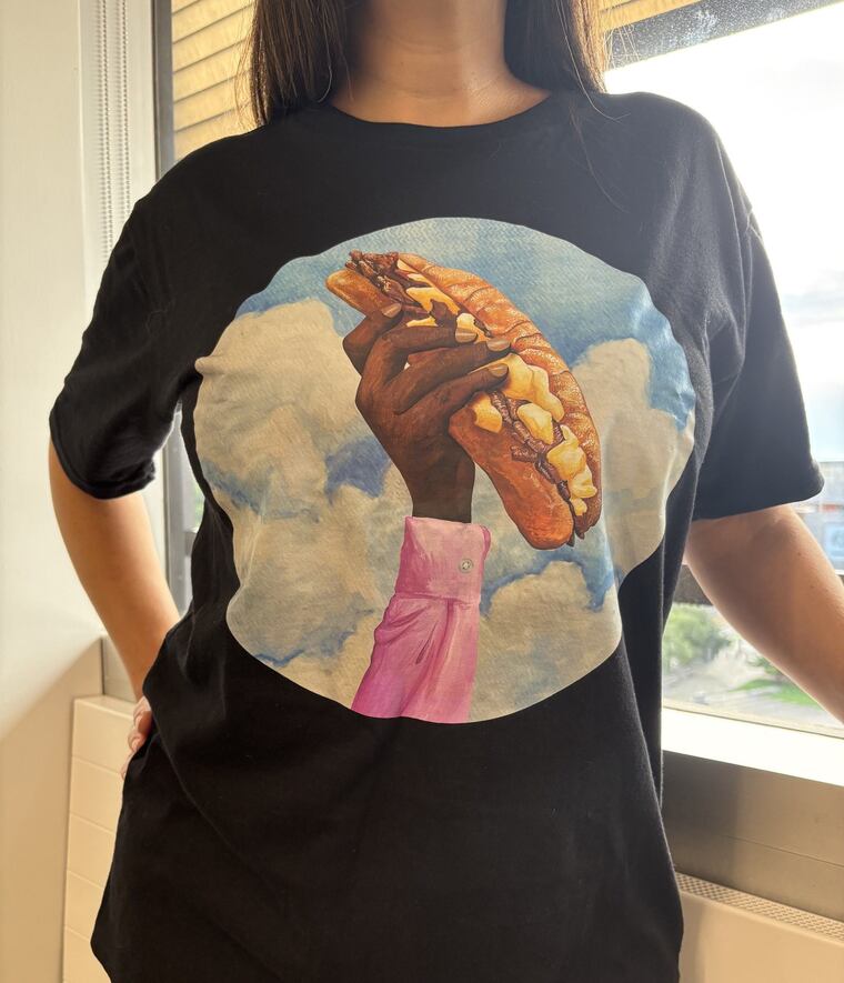 Sheila Bridges X COMOCO T-shirts featuring a Philly cheesesteak, are part of a limited-edition collaboration between interior designer Sheila Bridges and Stephen Satterfield, best known for the Netfix documentary on African American food, "High on the Hog."