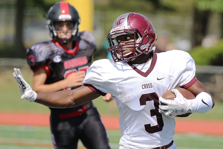 Holy Cross receiver Miles Cook gains yardage against Haddonfield.