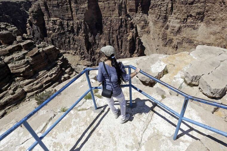 Little Colorado River Gorge is where Nik Wallenda performed his tightrope act Sunday. A tourist was taking in the viewfrom the Navajo reservation near Cameron, Ariz., on Saturday.