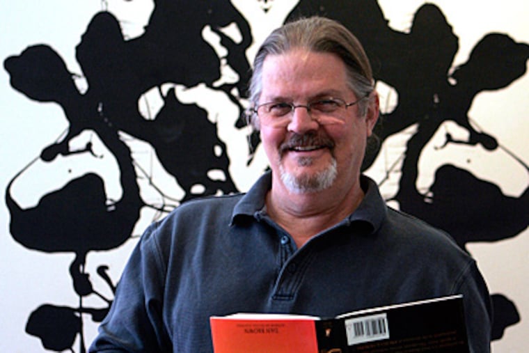 Narberth native John Langdon is the artist behind the funky-looking word designs in 'Angels & Demons.' (Bonnie Weller / Staff Photographer)