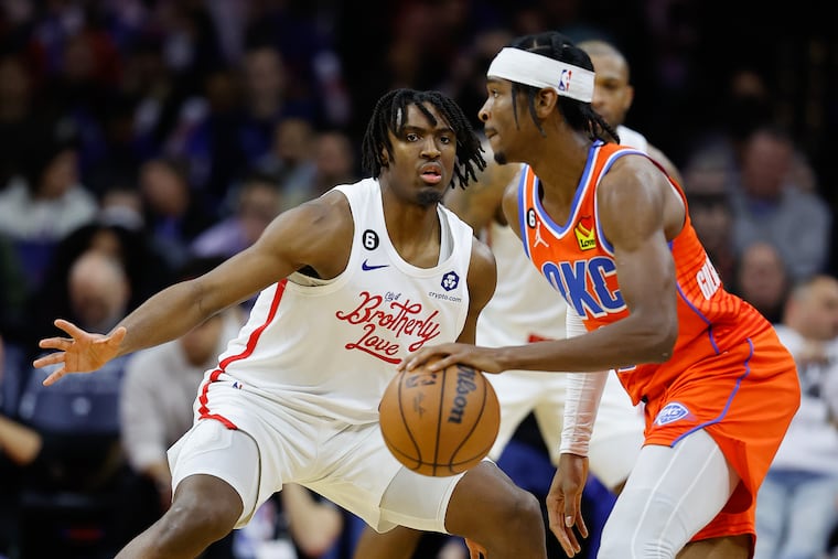 Sixers guard Tyrese Maxey defends Oklahoma City Thunder guard Shai Gilgeous-Alexander on Thursday.