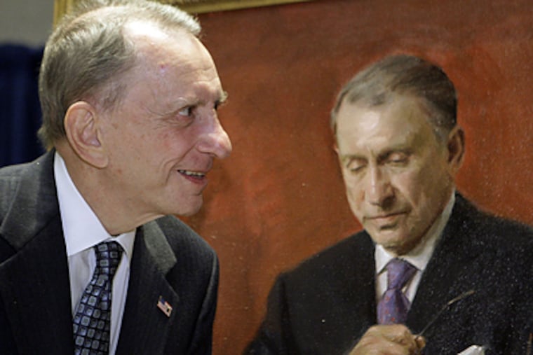Sen. Arlen Specter next to a portrait of him that will hang in the law school library at Yale University, which commissioned the work. (Matt Rourke/AP)