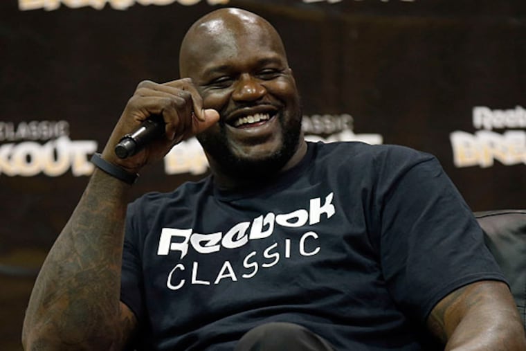 Former NBA player Shaquille O'Neal laughs during a panel discussion at the 2014 Reebok Classic Breakout. (Yong Kim/Staff Photographer)