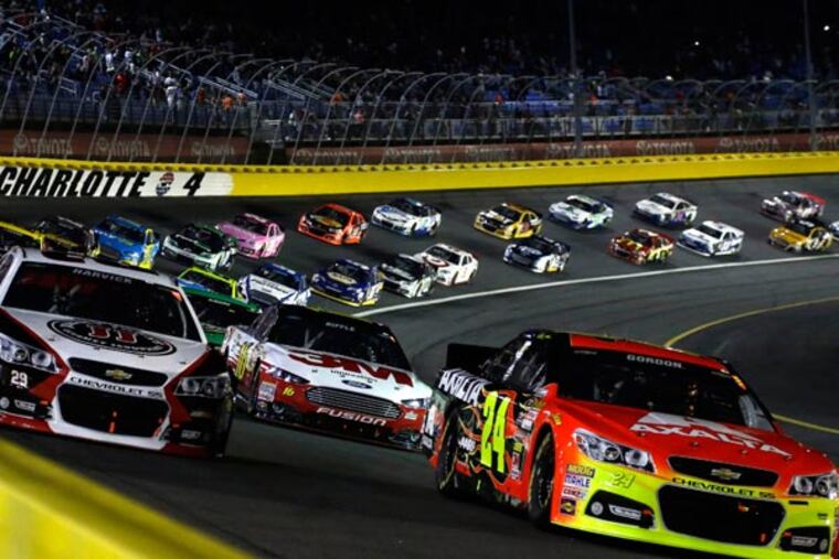 Jeff Gordon (24) leads the field of drivers out of Turn 4 approaching the start of the NASCAR Sprint Cup Series auto race at Charlotte Motor Speedway in Concord, N.C., Saturday, Oct. 12, 2013. (Gerry Broome/AP)