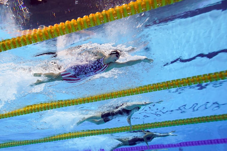 Katy Ledecky (left) swims in a 200-meter freestyle semifinal on Tuesday.