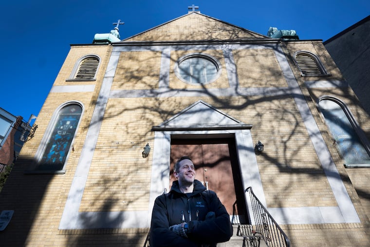 Jake Stein outside his newly purchased church in Philadelphia. He and his wife, Carrita Thomas, plan to renovate the historic building, transforming it into a family home.