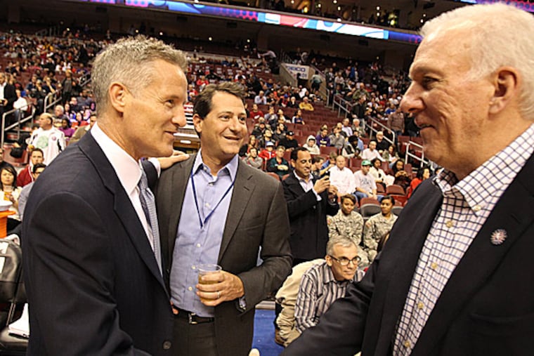 76ers head coach Brett Brown and Spurs head coach Gregg Popovich. (Charles Fox/Staff Photographer)