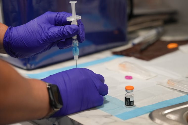 Diana Dur, public health nurse, works at a mobile vaccination clinic in Upper Darby in July. New data released on vaccination rates in Pennsylvania show that 93.9% of Delaware County kindergarteners are vaccinated against measles, below the 95% threshold that scientists say is necessary to prevent the spread of the highly contagious virus.