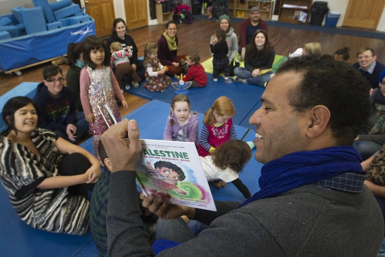 Barhim Benmbark, 39, from Morocco was asked to do the reading of children’s book P is for Palestine by Golbarg Bashi, an instructor of Middle Eastern Studies at Rutgers University. The public reading was held at the Children’s Community School of West Philadelphia, Sunday, December, 17, 2017.