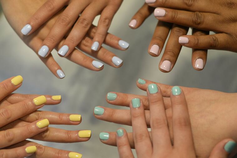 Saturated, pastel nails in a rainbow of colors pop against quiet palettes. (BEN MIKESELL / Staff Photographer)