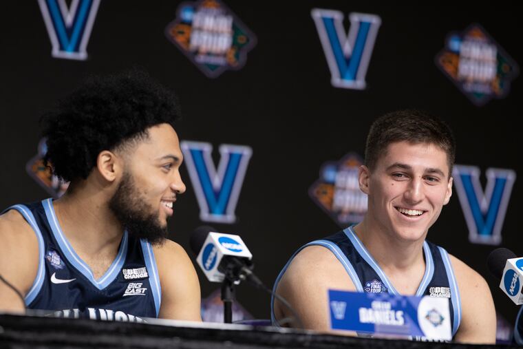 Caleb Daniels, left, and Collin Gillespie of Villanova joke about their initial one-on-one game during a press conference at the Final Four of the NCAA Tournament on March 31, 2022 at the Superdome in New Orleans.