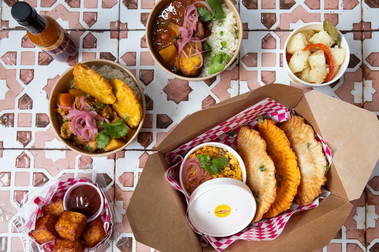 A spread of dishes including pastelillos at Amy’s Pastelillos, in the Fishtown section of Philadelphia, Pa. on Tuesday, Feb. 27, 2024. After a series of successful pop-ups, Amaryllis Rivera Nassar is opening a brick and mortar shop.