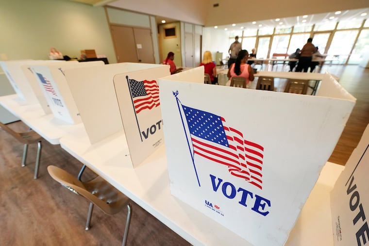 Empty poll kiosks await voters at the Mississippi Second Congressional District Primary election precinct in June in Jackson, Miss. Prosecutors are trying to stop the menacing of election workers as violent and graphic threats are deluging workers even in normally quiet periods between elections.