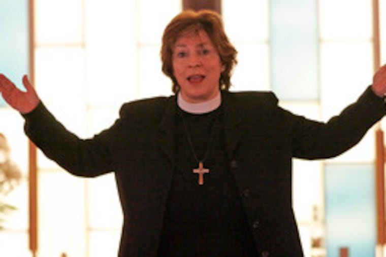 Bishop Claire S. Burkat of the Southeastern Pa. Synod, Evangelical Lutheran Church in America, speaks to mourners.