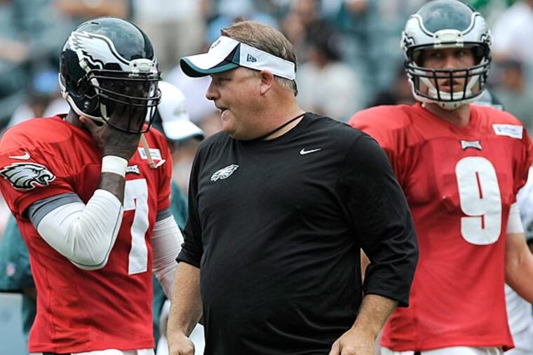 Chip Kelly remains quiet on the QB front. (AP Photo/Michael Perez)