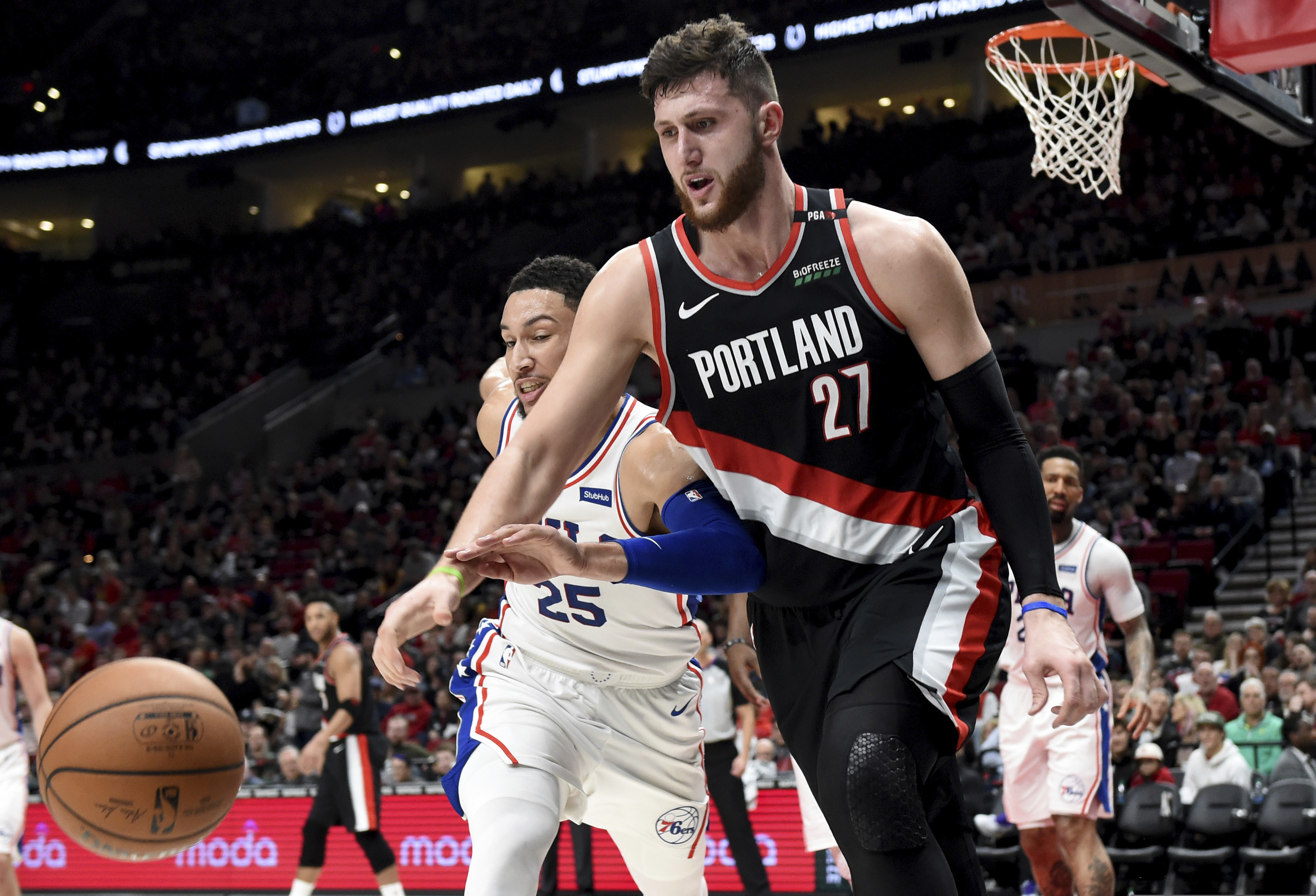 Ben Simmons, chasing after the ball against Portland's Jusuf Nurkic, scored 19 points Sunday. The Sixers struggled as a whole, however, in a 129-95 loss to the Blazers. (Steve Dykes / AP Photo)