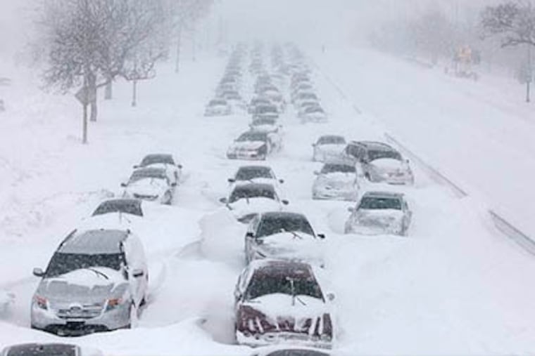 Hundreds of cars are seen stranded on Lake Shore Drive Wednesday, Feb. 2, 2011 in Chicago. (AP Photo / Kiichiro Sato)