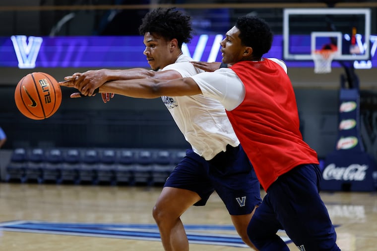 Villanova guards Acaden Lewis (right) and Tyler Perkins fighting for the ball during an open practice at the Finneran Pavilion in July.