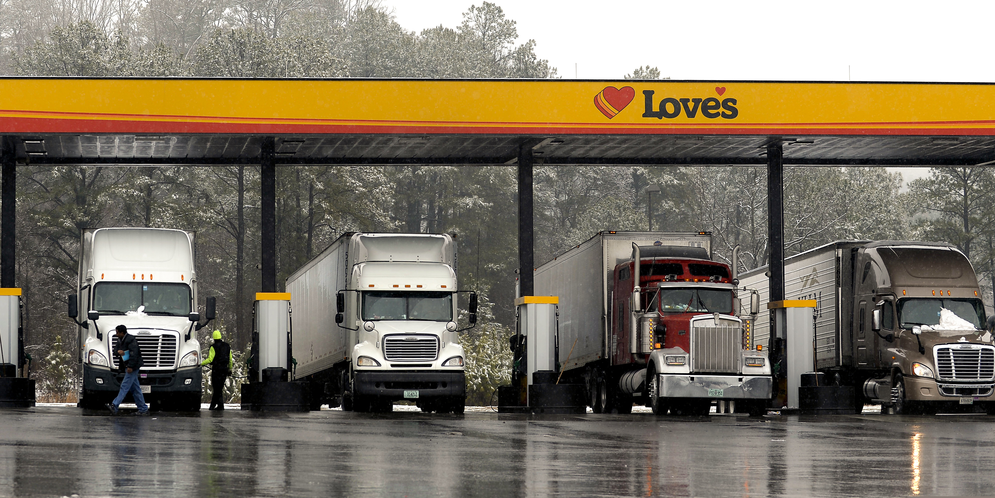 Truck drivers stop at a gas station in Emerson, Ga.