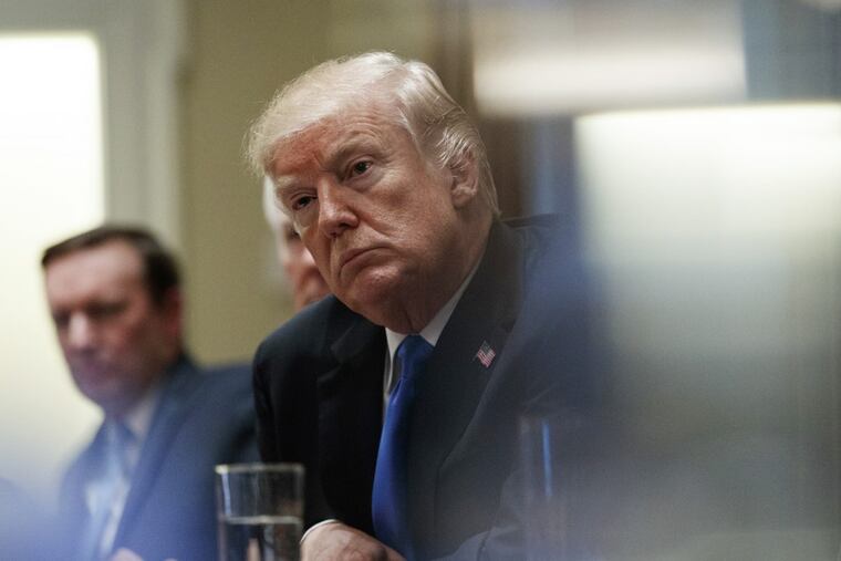 President Trump pauses during a meeting in the Cabinet Room of the White House, in Washington, Wednesday, Feb. 28, 2018, with members of Congress to discuss school and community safety.