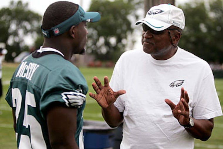 Ted Williams (right) is embarking on his 18th season as part of the Eagles' coaching staff. (Rich Schultz/AP file photo)