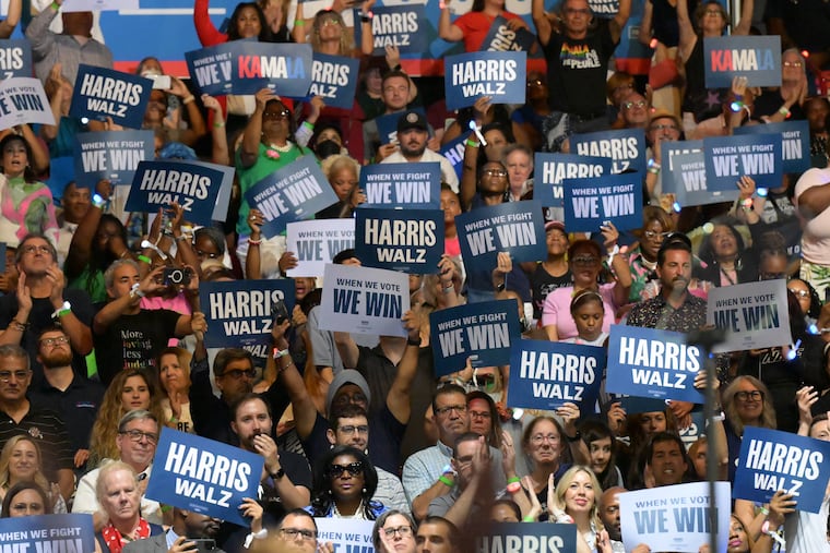 Supporters rally for Democratic presidential nominee Kamala Harris and her running mate, Minnesota Gov. Tim Walz, at the Liacouras Center at Temple University on Tuesday. Harris announced the selection of Walz ahead of their visit to Philadelphia.