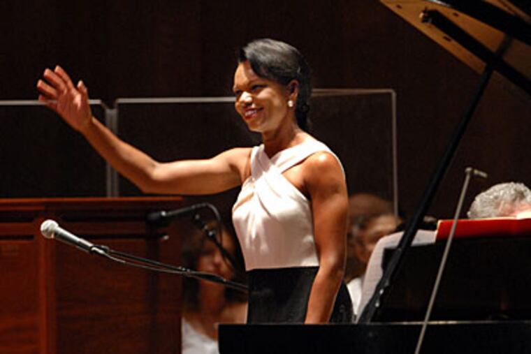Former Secretary of State Condoleezza Rice, a classically trained pianist, joined the Queen of Soul, Aretha Franklin, with the Philadelphia Orchestra at the Mann Center Tuesday night. Opponents of Bush-era policies had protested the concert, but Rice drew a warm reception last night. (APRIL SAUL / Staff Photographer)