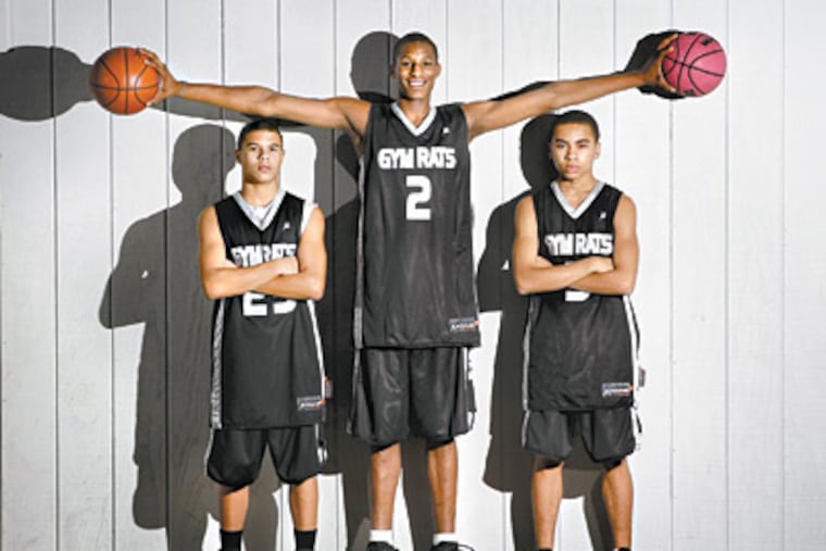 Horace Spencer III towers over teammates Michael Cohen (left) and Vince Jackson. (Michael S. Wirtz / Staff Photographer)