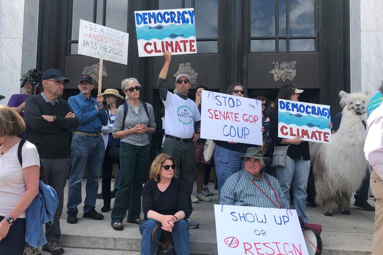 Protesters flood the steps of the Oregon State Capitol Tuesday, June 25, 2019, to push back against a Republican walkout over a climate-change bill that has entered its sixth day in Salem, Ore.