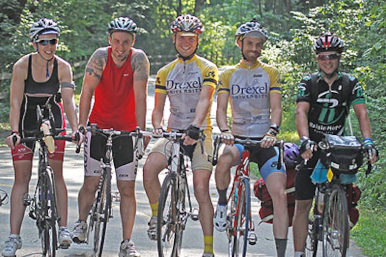 Doug Markgraf, right, prepares to head home from Valley Forge to East Falls with an escort of friends (from left): Christine Clement of Ambler, Christen Faughan of Cheltenham, Brell House of Kensington, and Joe Kopena of Center City. (Akira Suwa / Staff Photographer)