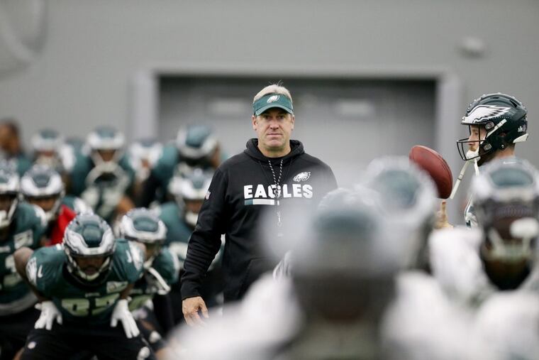 Head coach Doug Pederson watches players warm up during Eagles practice at the NovaCare Complex on Thursday, Jan. 25, 2018. TIM TAI / Staff Photographer