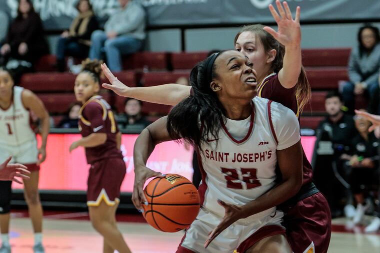 Saint Jospeh's Jaden Walker drives to the basketball at the Hagan Arena on Jan. 10.