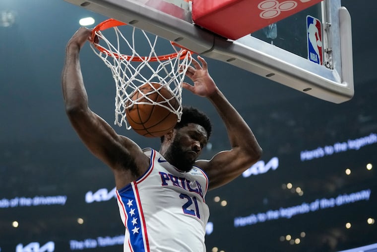 Philadelphia 76ers center Joel Embiid (21) dunks during the first half of an NBA basketball game against the Los Angeles Clippers in Los Angeles, Tuesday, Jan. 17, 2023. (AP Photo/Ashley Landis)