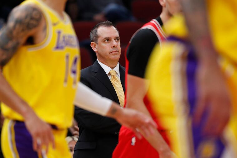 Eagles fan Frank Vogel watches his Lakers play the Chicago Bulls.