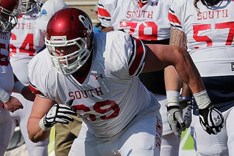 Senior Bowl South Squad offensive lineman Lane Johnson of Oklahoma (69) works out during Senior Bowl football practice at Ladd-Peebles Stadium in Mobile, Ala., Tuesday, Jan. 22, 2013. (Dave Martin/AP)