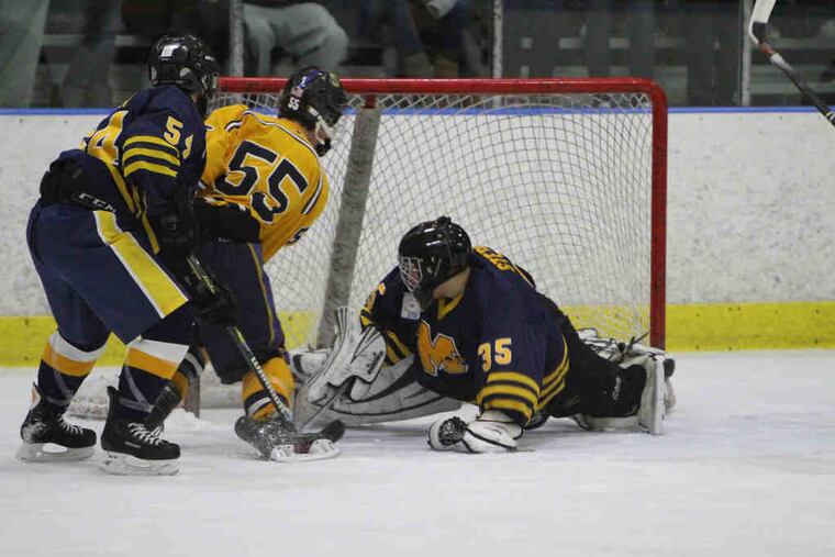 Springfield's Dave Allen (55) scores in the second period past Mars Area goalie Tyler Stepke to knot the score at 1.
