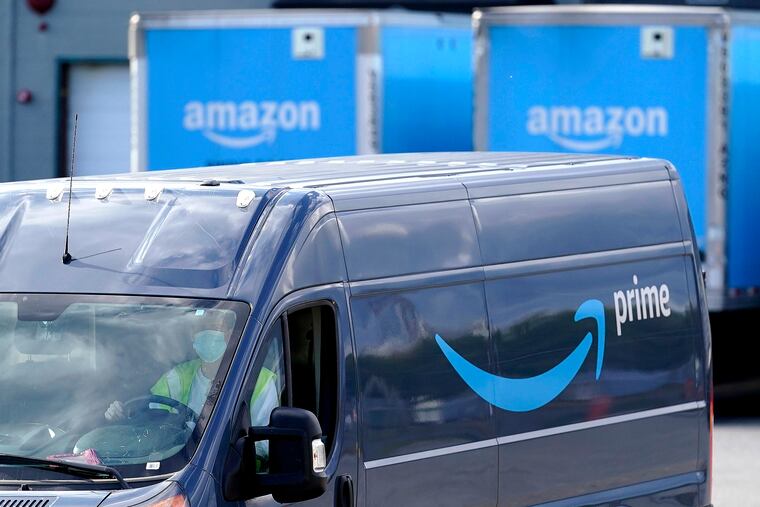 An Amazon delivery van departs a warehouse location in Dedham, Mass., in 2020.